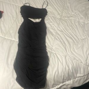 Black bodycon dress with slit in the middle. Windsor size small.